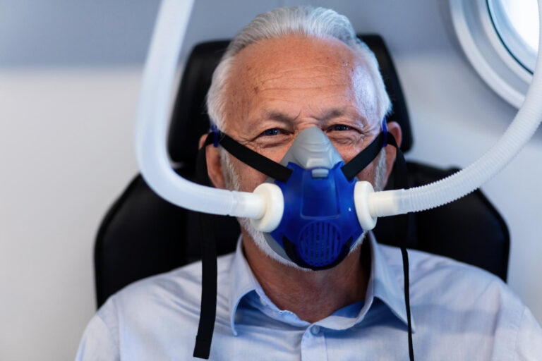 a dental patient wearing a mask used for dental sedation